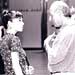 Componist/auteur Kim Koelewijn met haar vader in gesprek op de Buma/Stemra algemene ledenvergadering in Amsterdam (2000)